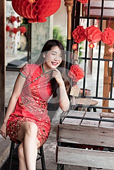 Asian woman wearing red traditional dress n chinese new year festival