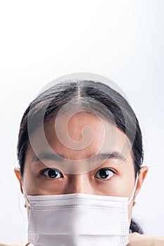 Asian woman is wearing sanitary gloves, mask on her face against coronavirus or COVID-19 disease. The Pollution Healthcare and