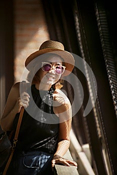 asian woman wearing sun glaases toothy smiling with happiness face