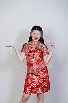 Woman wearing traditional cheongsam qipao dress photo