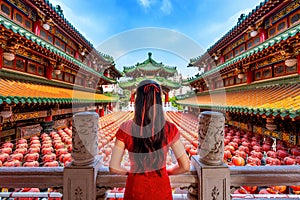 Asian woman wearing traditional Chinese dress at Sanfeng Temple in Kaohsiung, Taiwan photo