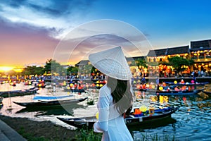 Asian woman wearing vietnam culture traditional at Hoi An ancient town,Hoi an city in Vietnam