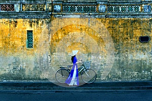 Asian woman wearing vietnam culture traditional at Hoi an, Vietnam