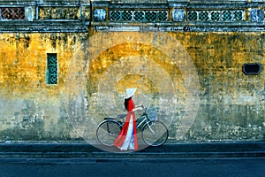 Asian woman wearing vietnam culture traditional at Hoi an, Vietnam