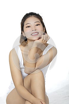 Asian woman wearing a white shirt on white backround