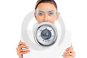 Asian woman with weight scale