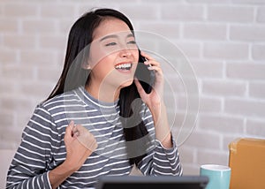 Asian woman working at home