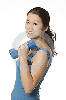 Asian woman working out using dumbbell weights isolated on white