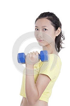 Asian woman working out using dumbbell weights isolated on white