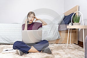 Asian woman working with smartphone or tablet on bed at home, Social media, stay home and quarantine or remote work and creativity