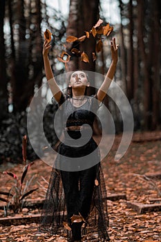 Asian Women blow away the leaf to the sky with happiness and energy