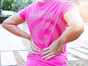 Asian women with body aches, back pain and waist pain.Ã¯Â¿Â¼ photo