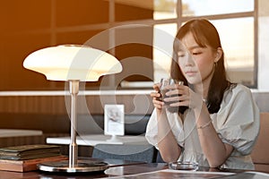 asian women drinking coffee in cafe