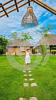 Asian women at a Eco farm homestay with a rice field in central Thailand