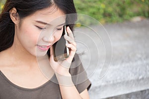 Asian women enjoy on phone call.