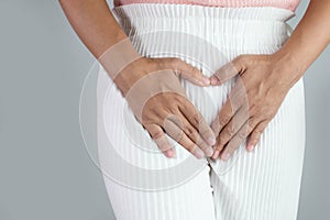 Asian women have problems with hidden spots, Have itching from vaginal discharge. Healthcare and medical concept