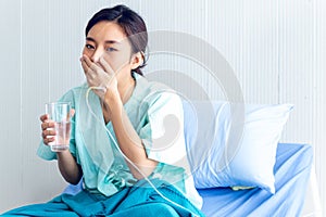Asian women have stress. Due to coronavirus or covid 19 infection and recovering In a patient bed in a special patient room