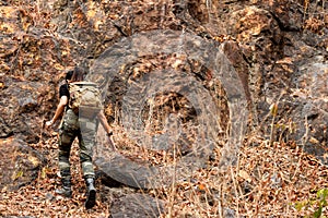 Asian Women hiker or traveler with backpack adventure climb up  and explore on mountain nature outdoor weekend.