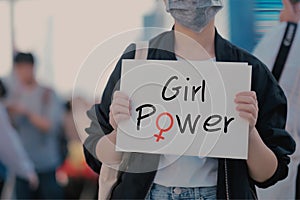 Asian women holding white paper and Girl power text on paper,feminisms movement