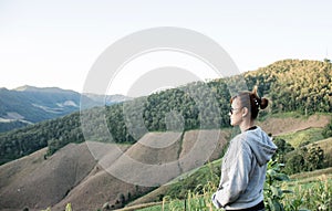 Asian women looking beautiful landscape mountains green fields and corn farm in the morning