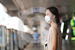 Asian women with medical face mask to protect the Covid-19, new normal lifestyle