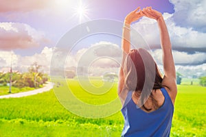 Asian women relax arm stretching wakeup in the morning rural