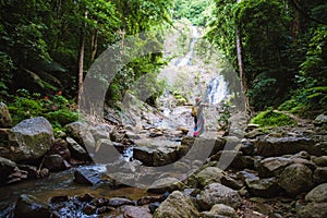 Asian women relax in the holiday. Travel waterfall On the Moutain Huai Toh waterfall at Krabi. travel nature, Travel relax,