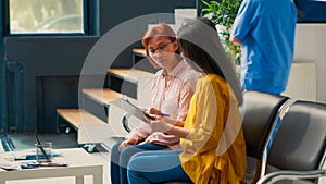 Asian women sitting in waiting area to attend checkup visit
