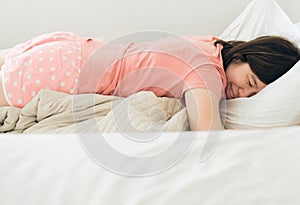 Asian women sleeping on the bed and grinding teeth,Female tiredness and stress