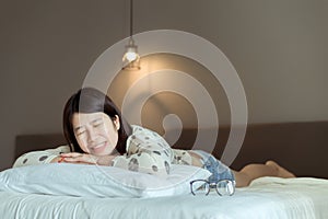 Asian women sleeping on the bed and grinding teeth,Female tiredness and stress