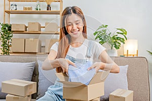 Asian women SME freelance working with packaging startup entrepreneur small business owner at home,Online business seller