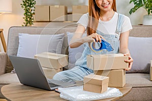 Asian women SME freelance working with packaging startup entrepreneur small business owner at home,Online business seller