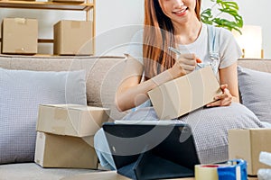 Asian women SME freelance working with packaging startup entrepreneur small business owner at home,Online business seller photo