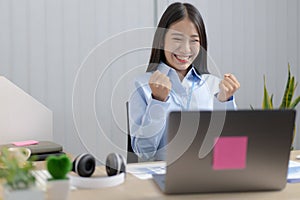 Asian women are successful and happy to be able to meet their targets, Excited