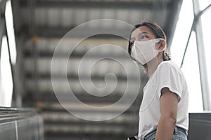 Asian women with surgical mask in public space