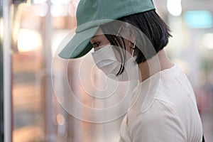 Asian women and surgical mask shopping some food in supermarket, covid-19 crisis