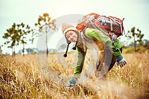 Asian women travel  nature. Travel relax.Backpack walk on the meadow in the forest. Thailand