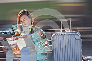 Asian women traveler,map and hologram hologram show results,Hotels,attractions, travel itineraries,restaurants in train photo