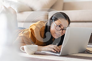 Asian women using laptops at home
