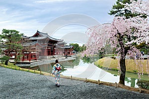 Asian women wearing traditional japanese kimono in Byodo-in Temp