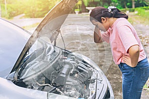 Asian women worry and stress a trouble with car