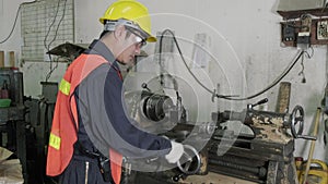 Asian worker or engineer checking lathes before use. Industrial and engineering concept.