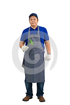 Asian worker man in blue shirt with apron and protective gloves hand holding Shoveling fork isolated on white