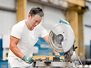 Asian worker in production plant on the factory