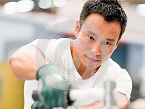 Asian worker in production plant on the factory