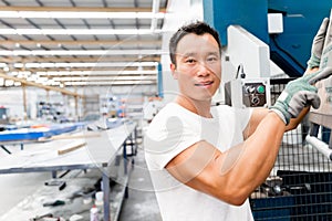Asian worker in production plant on the factory