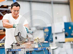 Asian worker in production plant on the factory floor