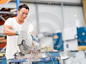 Asian worker in production plant on the factory floor