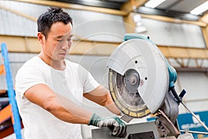 Asian worker in production plant on the factory floor