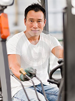 Asian worker in production plant on the factory floor